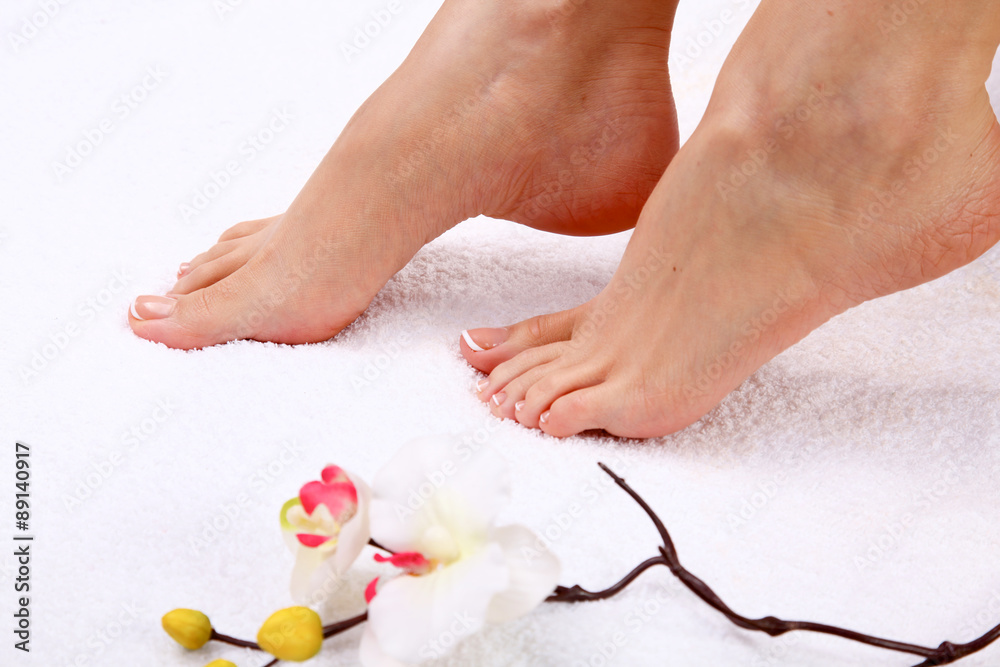 pedicure on legs and beautiful manicure on hands closeup pedicure on legs and beautiful manicure on hands closeup