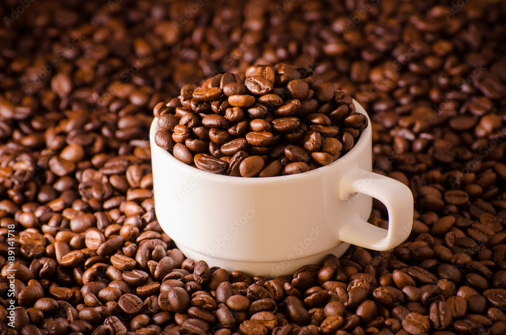 Coffee cup and coffee beans around Coffee cup and coffee beans around