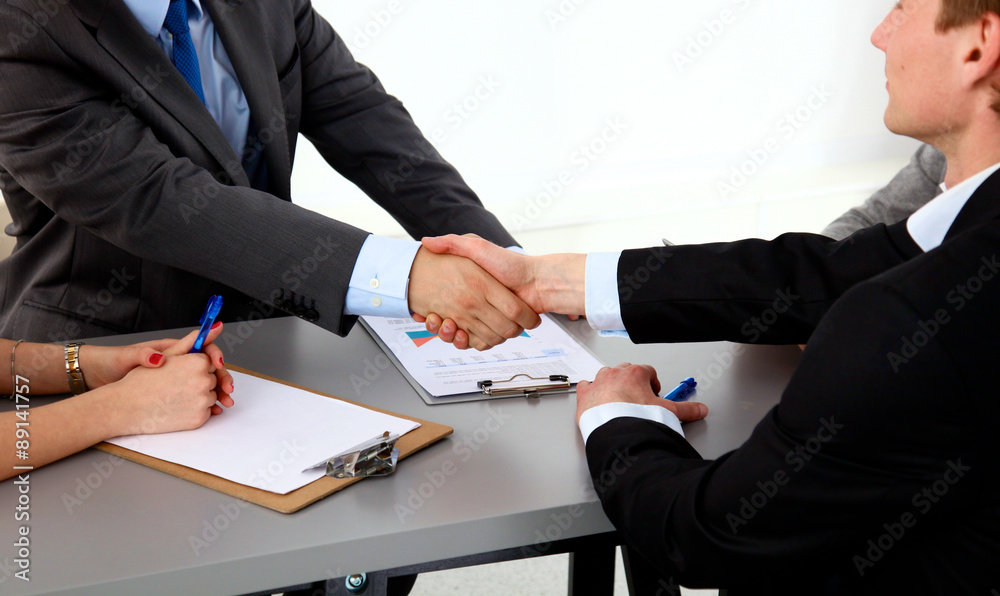 Fototapeta premium Business meeting at the table shaking hands conclusion of the