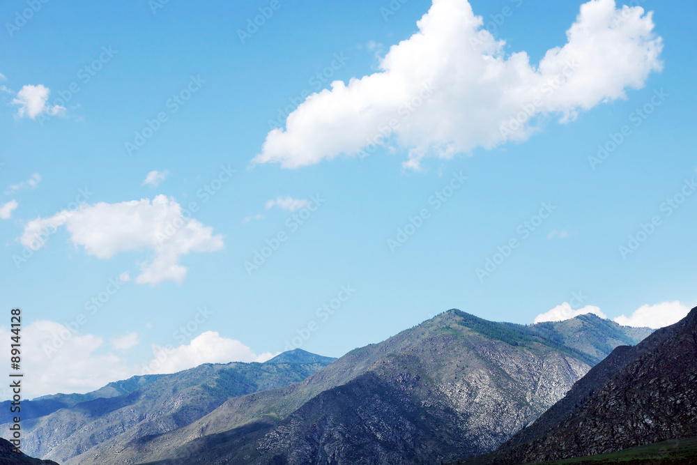 Mountain peaks in the sunny summer day