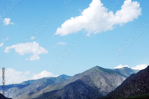 Mountain peaks in the sunny summer day © Alex_Po