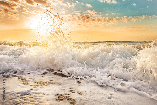 Fototapeta Naklejka Na Ścianę i Meble -  Splashes of wave at sunrise.
