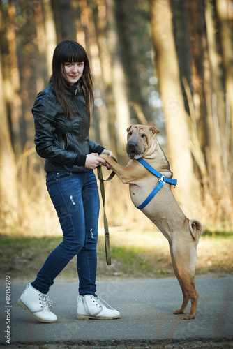 girl with dog in the park © Aliaksei Lasevich