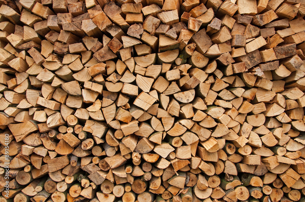 Chopped firewood logs as an abstract background Chopped firewood logs as an abstract background