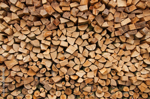 Chopped firewood logs as an abstract background