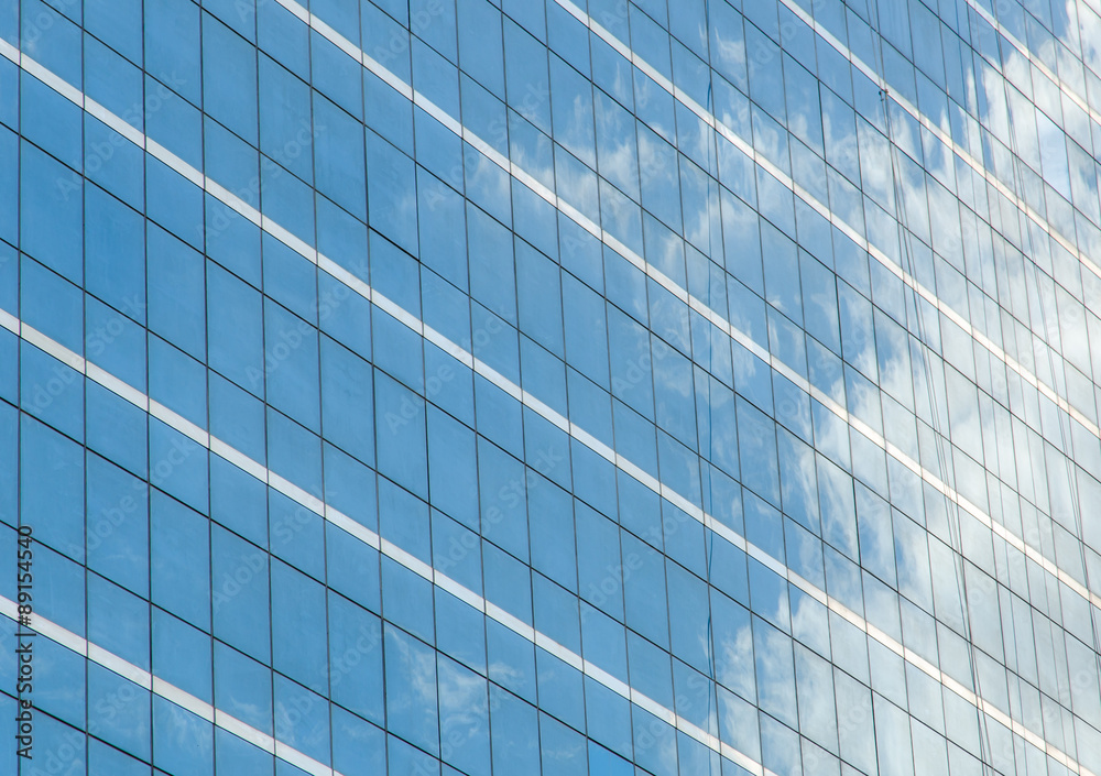 Reflection in glass wall of business building