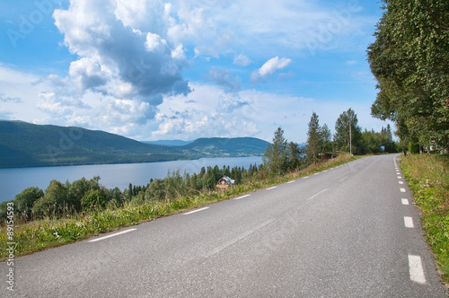 Road by lake. Scenic landscape near Ostersund in Northern Sweden on an overcast day. photo