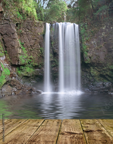 Mountain waterfall with wooden pier