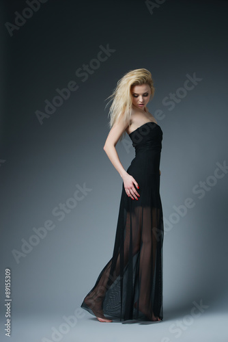 beautiful fashionable woman in black dress