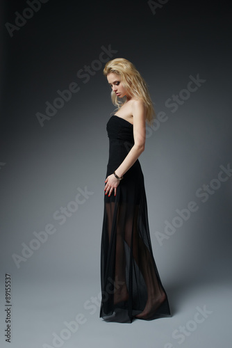 beautiful fashionable woman in black dress