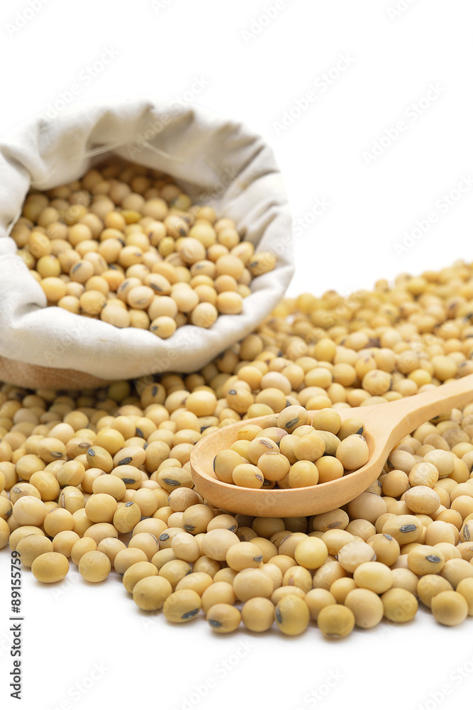 Isolated soy beans focus on wooden spoon Isolated soy beans focus on wooden spoon