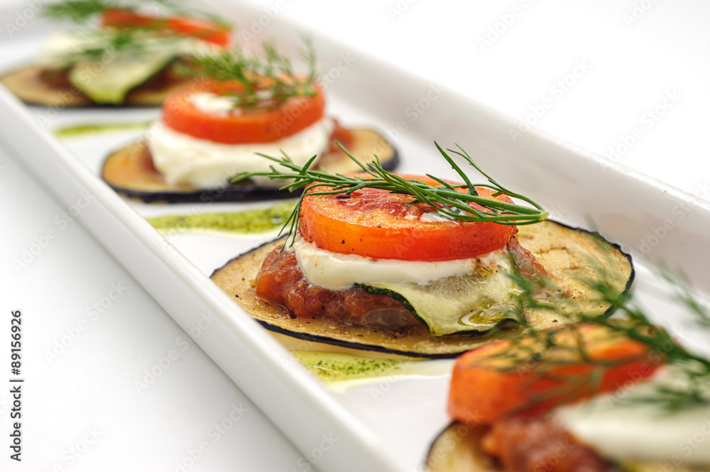 Hot appetizer with fried eggplant isolated on white Hot appetizer with fried eggplant isolated on white