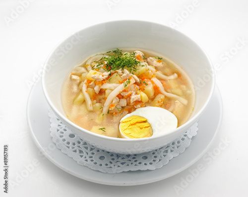 Noodles soup with egg isolated on white