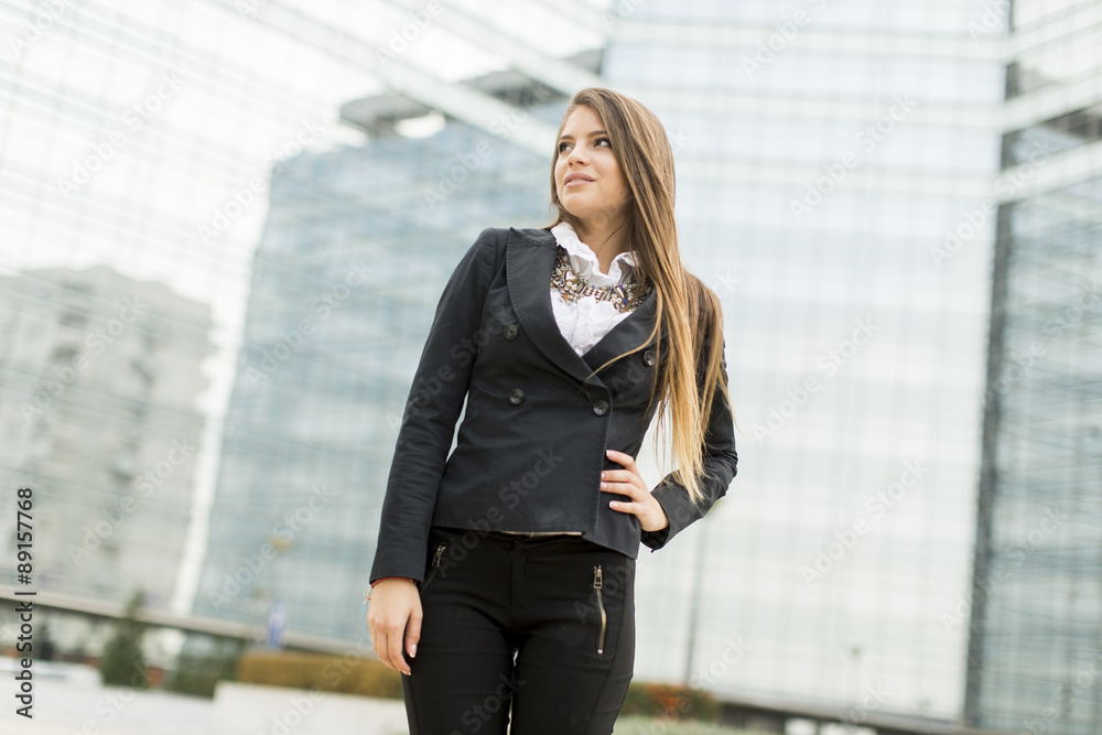 Business woman in front of office building Business woman in front of office building