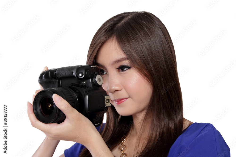 Asian girl looks focused while taking a picture Asian girl looks focused while taking a picture