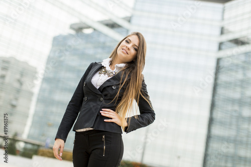 Business woman in front of office building