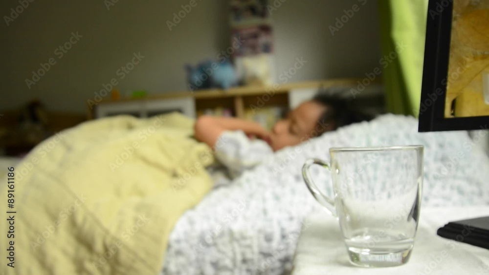Close up on glass of water that boy sleep and wake up to drink Close up on glass of water that boy sleep and wake up to drink