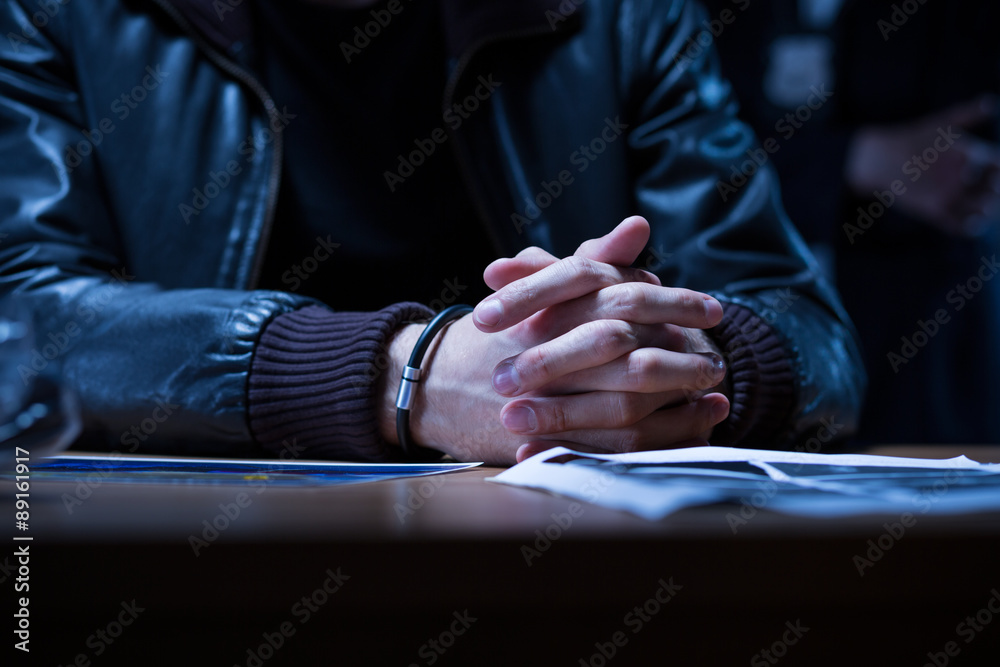 Close-up of arrested man