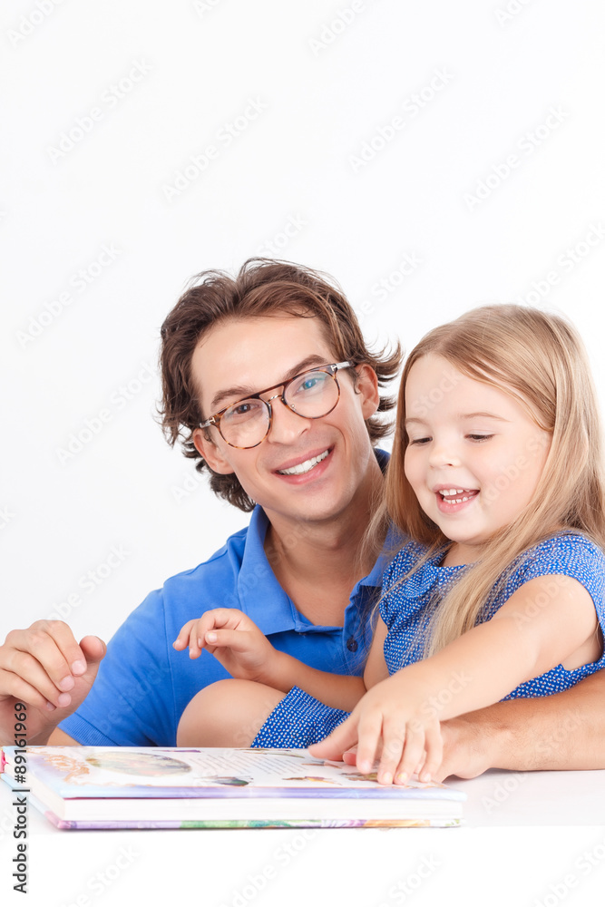 Father reading with his daughter Father reading with his daughter