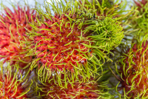 Closeup fresh Rambutan is a fruit with sweet red shell