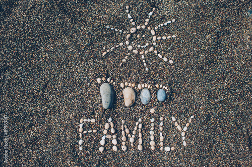 Happy feet. Stone arranged like a footprint on the beach photo