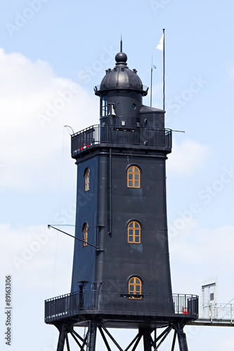 Obereversand lighthouse at the wadden sea photo