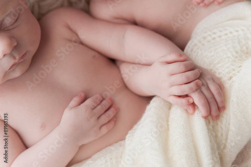 Twin Baby Girls Holding Hands