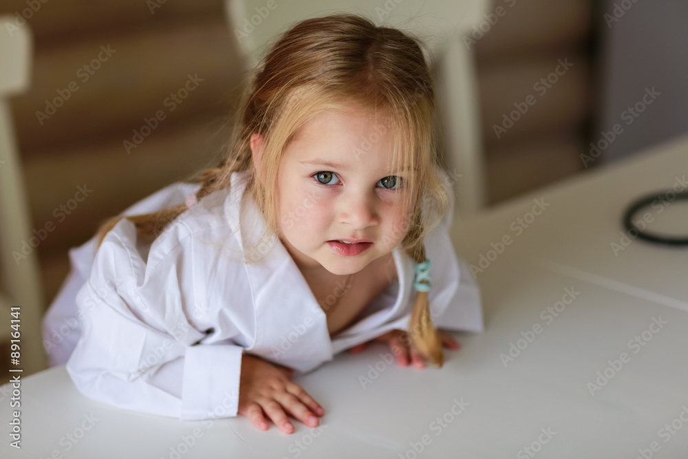 girl sitting at the table girl sitting at the table