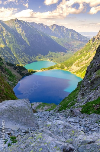 Two lakes in mountains. Two blue mountain lakes surrounded by high summits. M...
