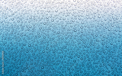 Blue wet surface with water drops 