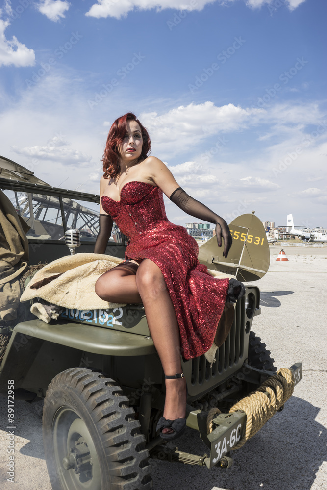 pinup dressed in era of the Second World War, beauty redheaded w