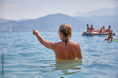 Young girl bathing in lake Attersee