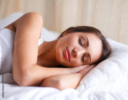 Pretty woman lying in bed