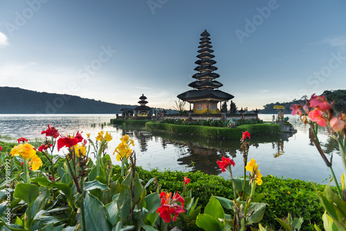 flowers Pura Ulun Danu temple on a lake Beratan, Bali, Indonesia, HDR style