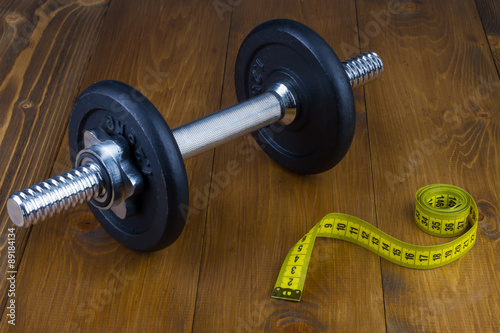 Dumbbell and tape measure