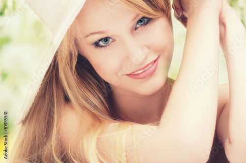 Beautiful Young Woman in a Hat Looking at Camera..