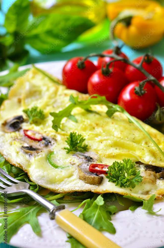 Omelet stuffed with champignon and cheese.