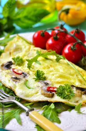 Omelet stuffed with champignon and cheese.