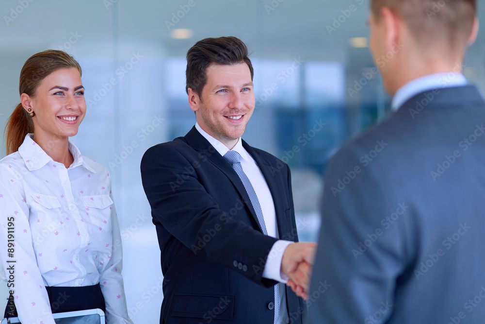 Two successful business men shaking hands with each other Two successful business men shaking hands with each other