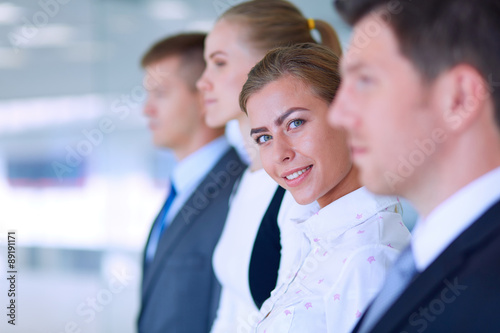 Photos Smiling successful business team standing in office