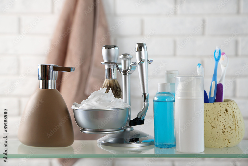 Male luxury shaving kit on shelf, on bricks wall background Male luxury shaving kit on shelf, on bricks wall background