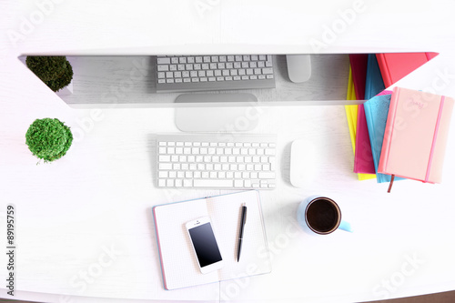 Office workplace with modern computer, top view