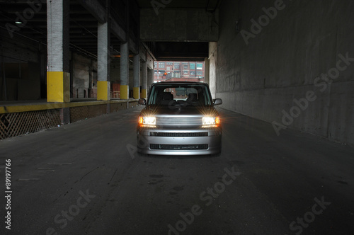 SUV using headlights in tunnel