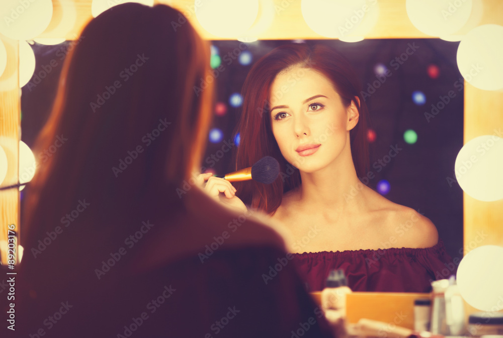 Portrait of a beautiful woman as applying makeup Portrait of a beautiful woman as applying makeup