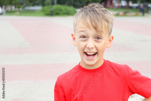 boy's face contorts emotions
