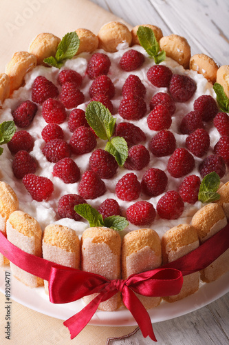 raspberry cake with mascarpone and Savoiardi close-up. vertical
