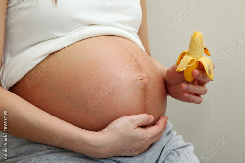 Pregnant Woman Holding Banana