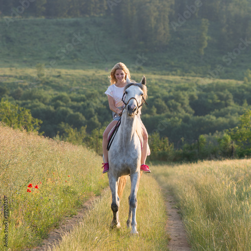 Young woman with horse outdoor © Laszlo