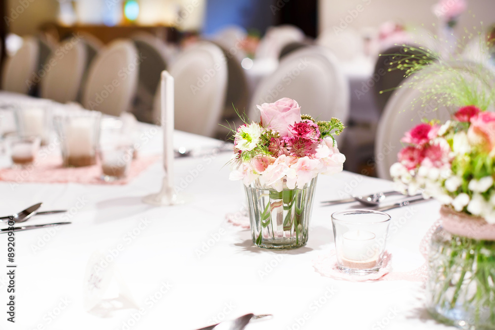 Table set in pink and white for wedding or event party. Table set in pink and white for wedding or event party.