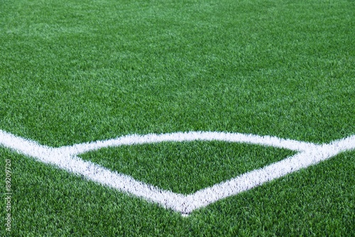 White line corner on green football field